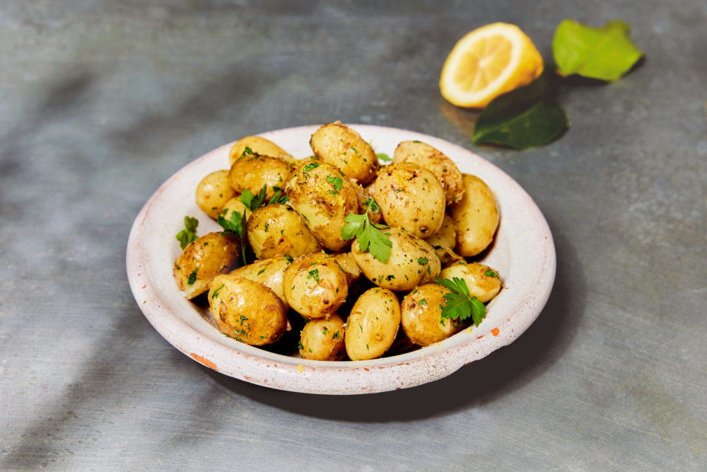 Roast jersey royals with butter dressing recipe